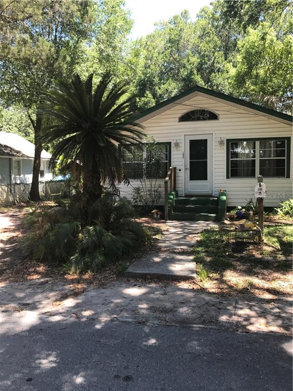 5651 Homecrest Road New Port Richey, FL 34652 - Photo 1 of 1 a front view of a house with garden