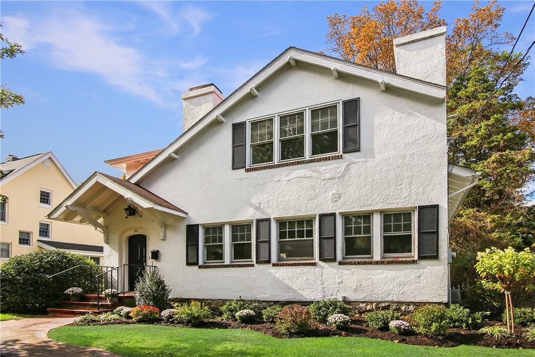 22 Halsted Place Rye, NY 10580 - Photo 1 of 1 a front view of a house with a yard and garage