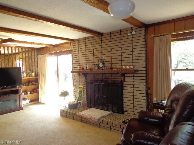 2066 Browns Crossroads Road Staley, NC 27355 - Photo 2 of 17 Den/Greatroom has Wood Burning FP. Exposed Beams and Built-In bookcases