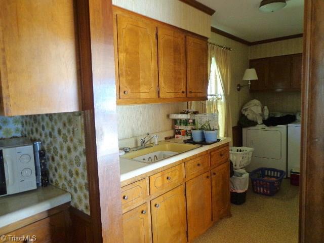 2066 Browns Crossroads Road Staley, NC 27355 - Photo 5 of 17 Laundry Room has Built-In Cabinets and utility Sink