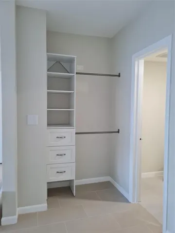 a view of an empty walk in closet