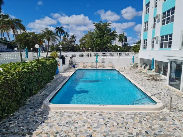 a view of a backyard with palm trees