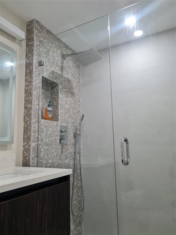 600 North Birch Road, Unit 301H Fort Lauderdale, FL 33304 - Photo 9 of 18 a bathroom with a shower and a sink