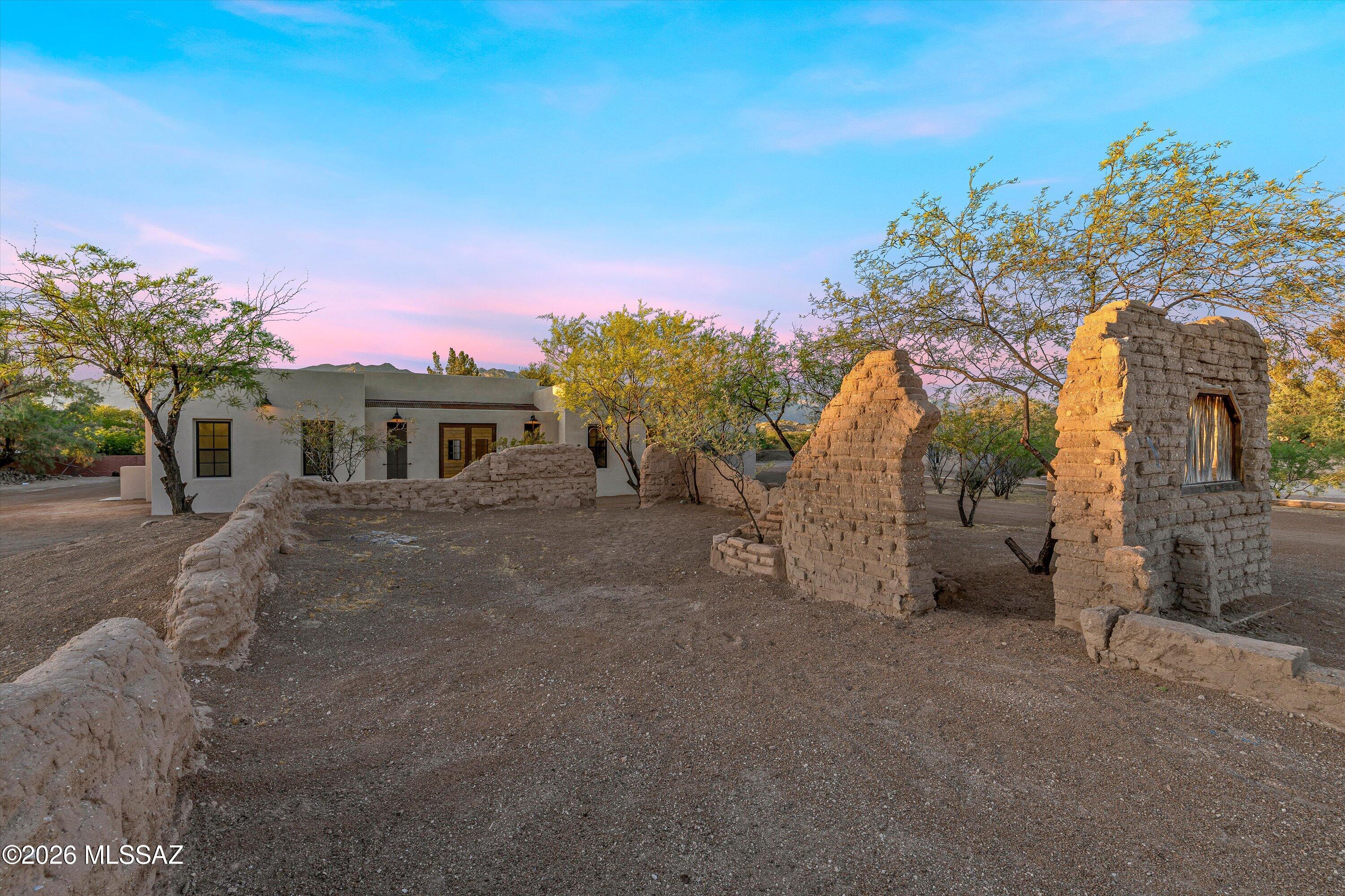 5259 East Fort Lowell Road Tucson, AZ 85712 - Photo 2 of 50 a front view of a house with a yard and garage