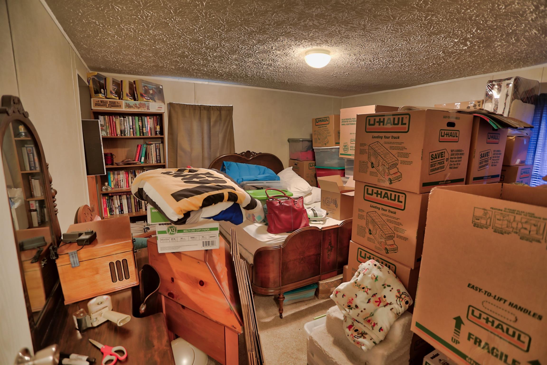 3686 Armstrong Road Springfield, TN 37172 - Photo 21 of 30 a bed room with a bed and a book shelf
