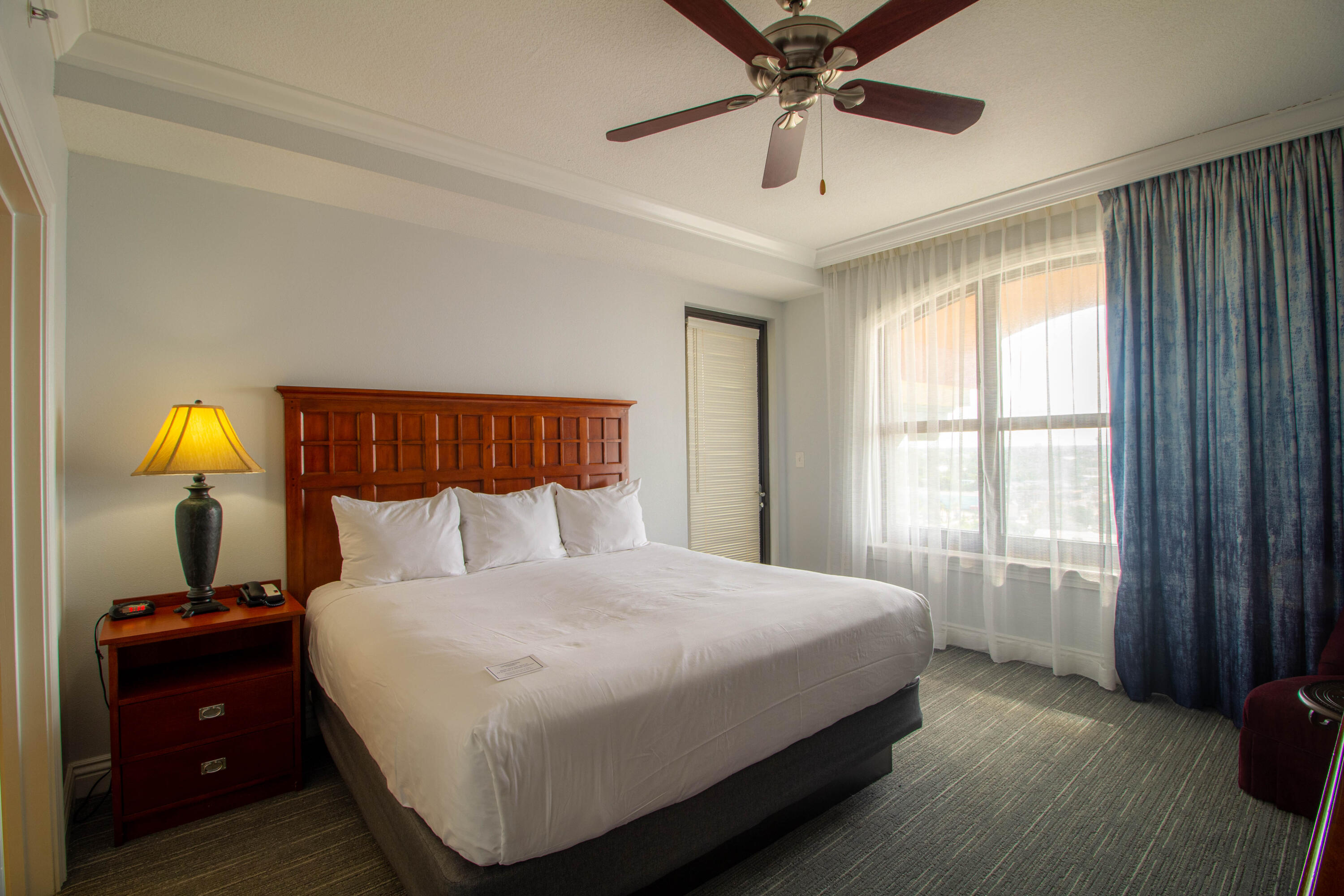 10 Harbor Boulevard, Unit E507F Destin, FL 32541 - Photo 11 of 28 a bedroom with a bed and window