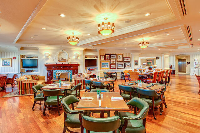 10 Harbor Boulevard, Unit E507F Destin, FL 32541 - Photo 20 of 28 a view of a dining room with furniture and wooden floor