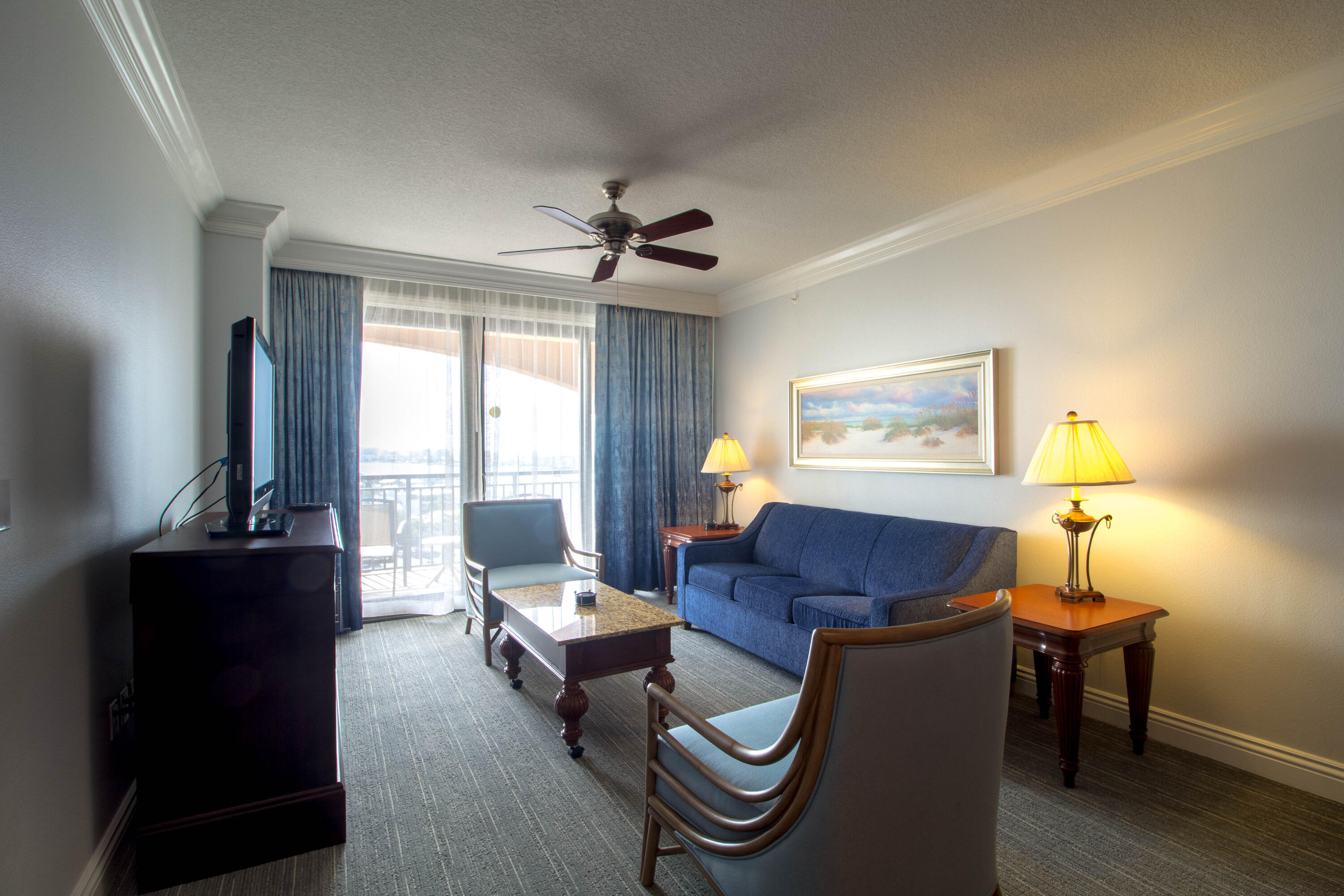10 Harbor Boulevard, Unit E507F Destin, FL 32541 - Photo 3 of 28 a living room with furniture a lamp and a potted plant