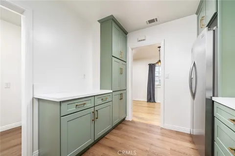 a bedroom with a bed and a chair
