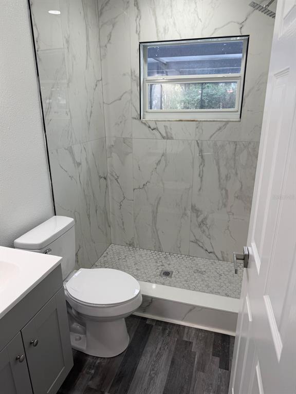 Undisclosed Address Port Richey, FL 34668 - Photo 5 of 19 a bathroom with a toilet and a shower