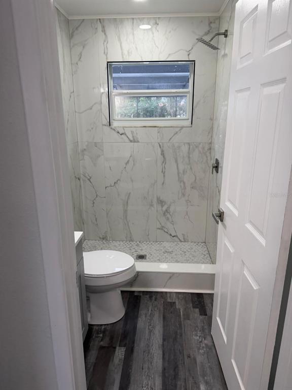 Undisclosed Address Port Richey, FL 34668 - Photo 7 of 19 a bathroom with a toilet and a shower