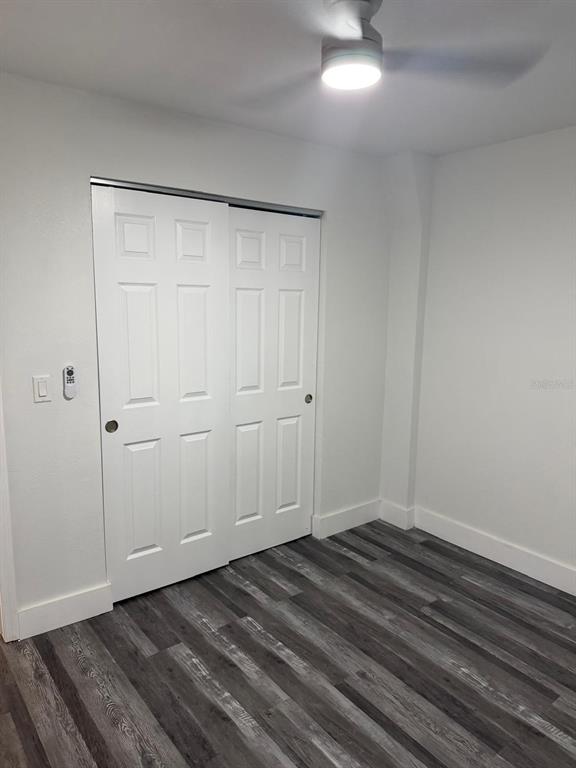 Undisclosed Address Port Richey, FL 34668 - Photo 10 of 19 a view of empty room with wooden floor