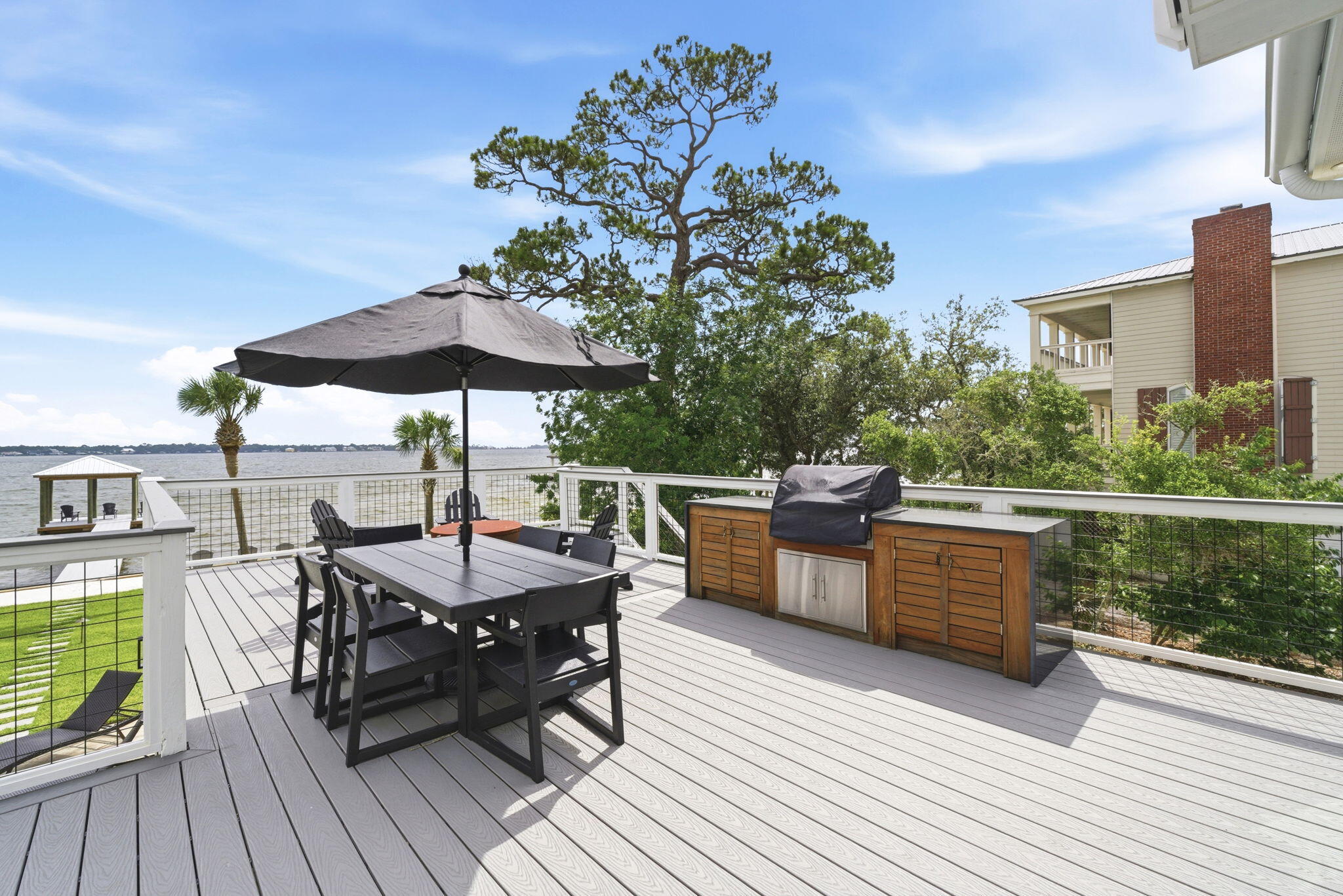 31061 Peninsula Drive Orange Beach, AL 36561 - Photo 26 of 93 a view of a roof deck with table and chairs
