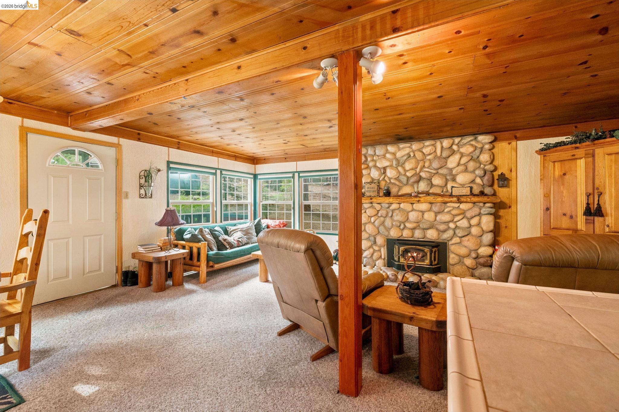 25822 Long Barn Sugar Pine Road Long Barn, CA 95335 - Photo 14 of 28 a view of a livingroom with furniture and a window