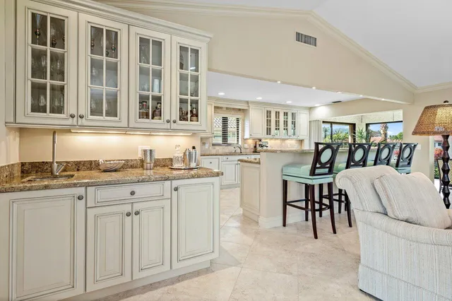 a living room with granite countertop furniture and a sink