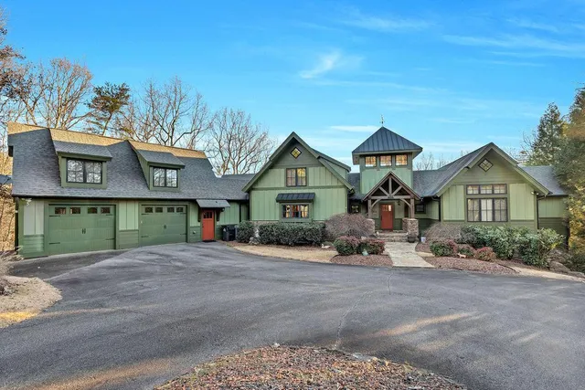 a view of a room that has a bed and a window