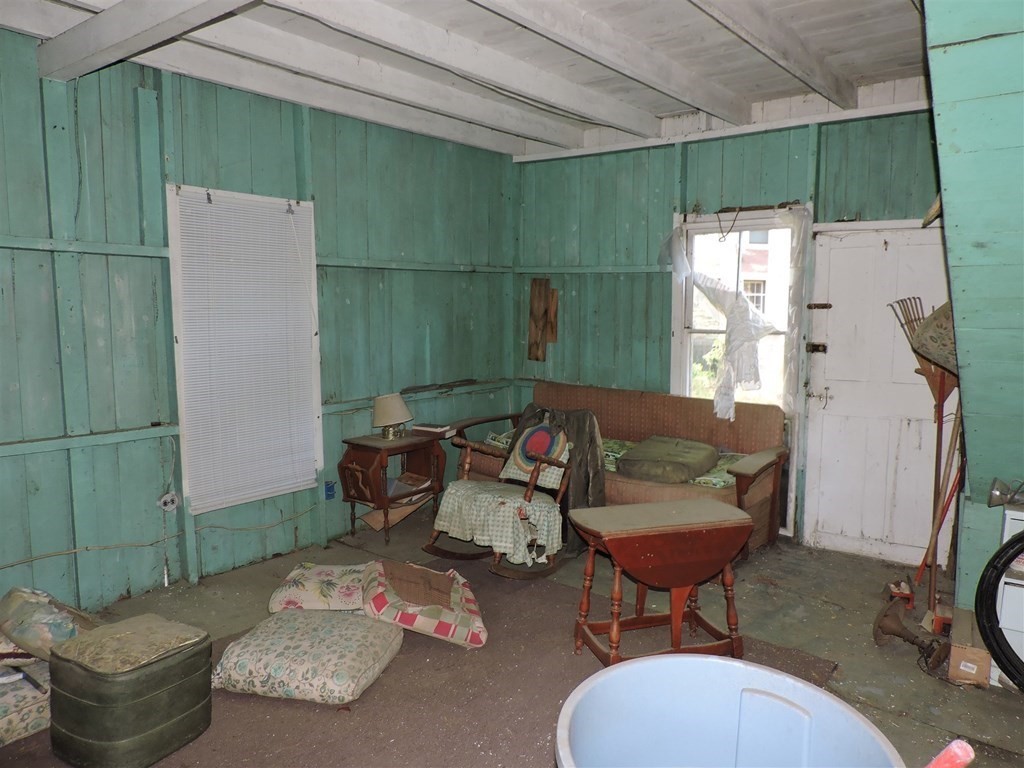 4 Long Island Webster, MA 01570 - Photo 16 of 27 a living room with furniture and a fireplace