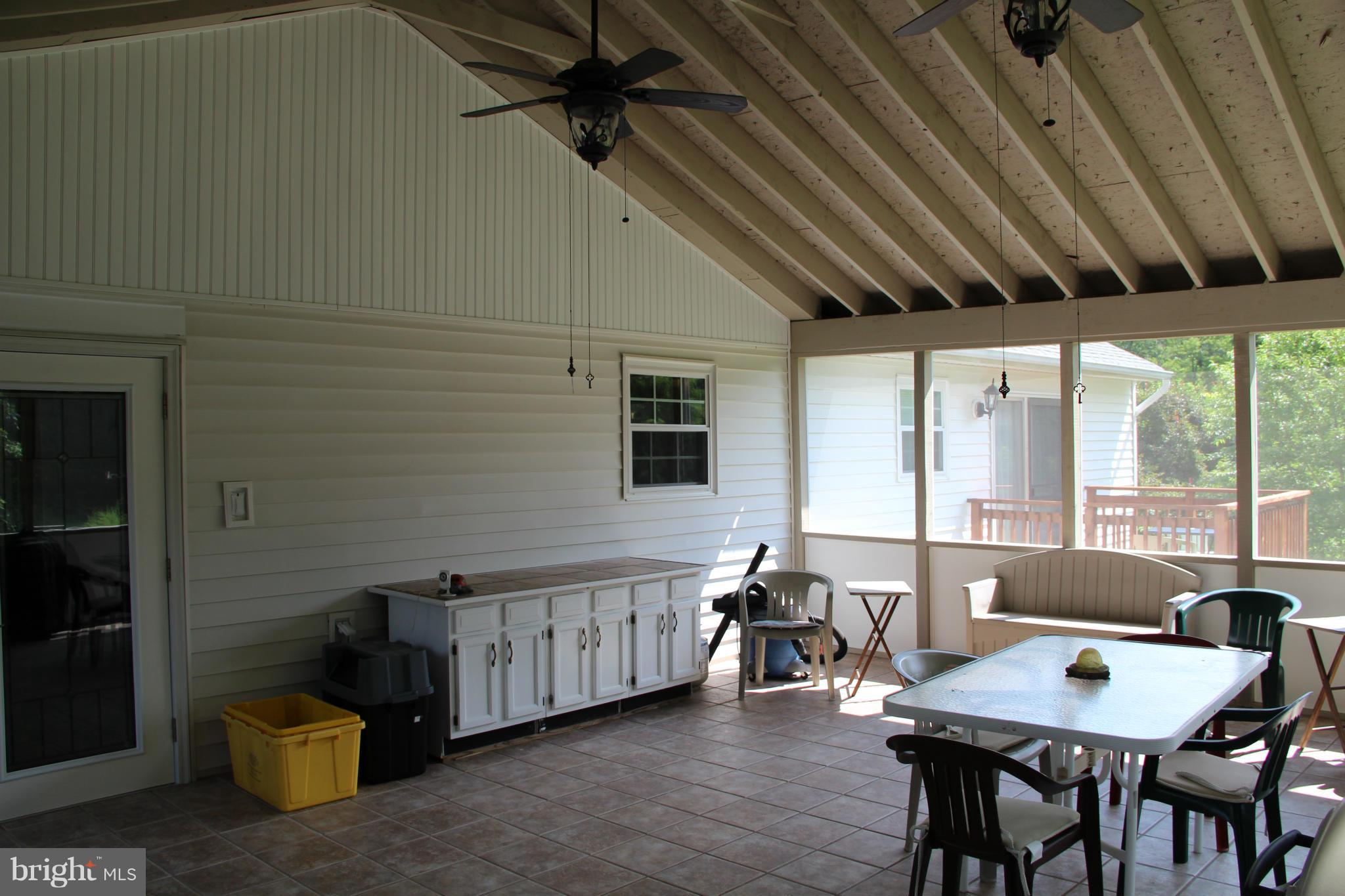 3155 Plum Point Road Huntingtown, MD 20639 - Photo 28 of 29 Screened Deck with Ceramic Tile Floors