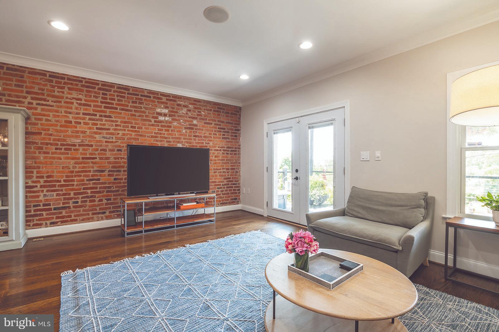 2026 North Capitol Street Northwest, Unit 1 Washington, DC 20002 - Photo 14 of 53 Living room with doors to private back deck