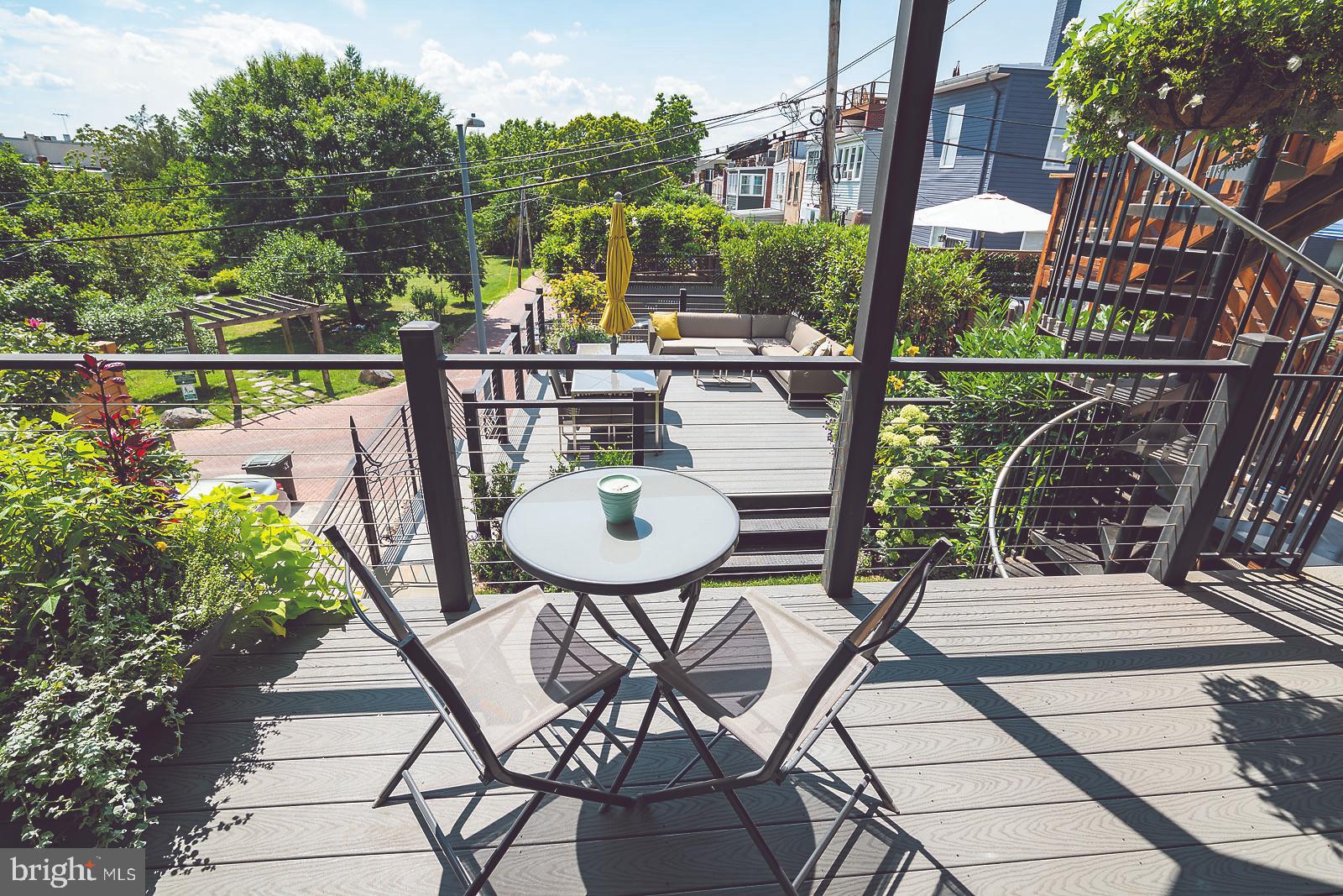 2026 North Capitol Street Northwest, Unit 1 Washington, DC 20002 - Photo 15 of 53 Private back deck #1 overlooking yard and park