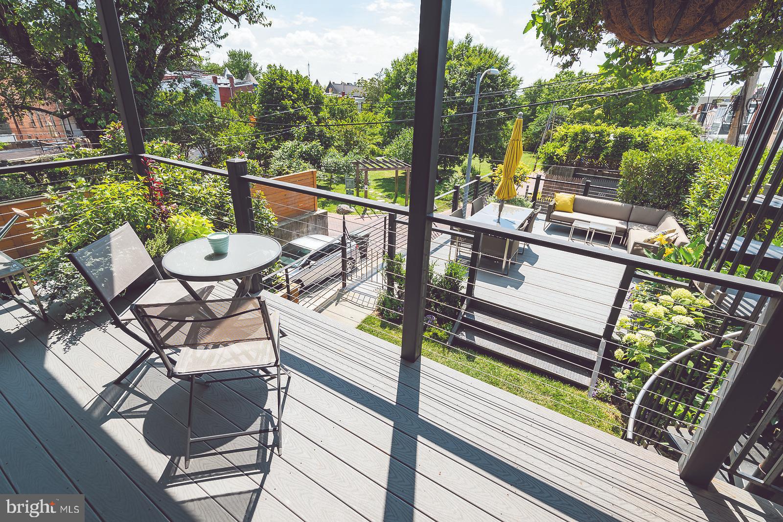 2026 North Capitol Street Northwest, Unit 1 Washington, DC 20002 - Photo 16 of 53 Private back deck #1 overlooking yard and park