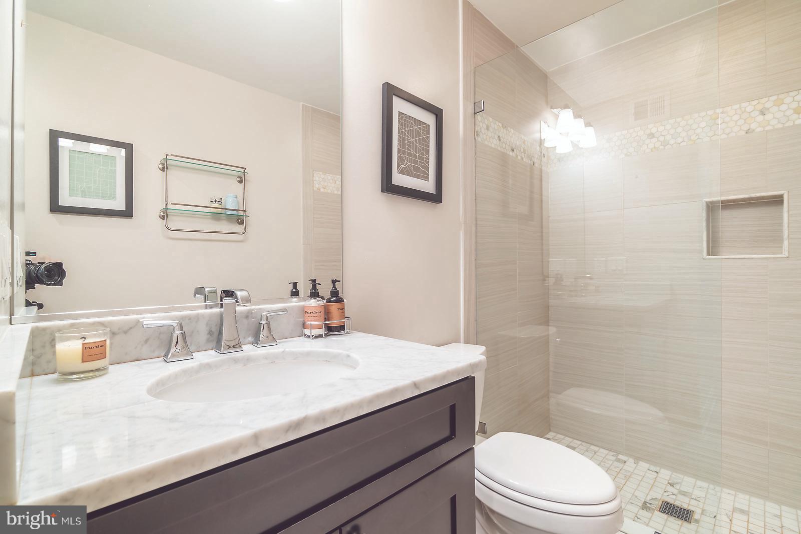 2026 North Capitol Street Northwest, Unit 1 Washington, DC 20002 - Photo 23 of 53 Full bathroom #1 with dual entry pocket doors
