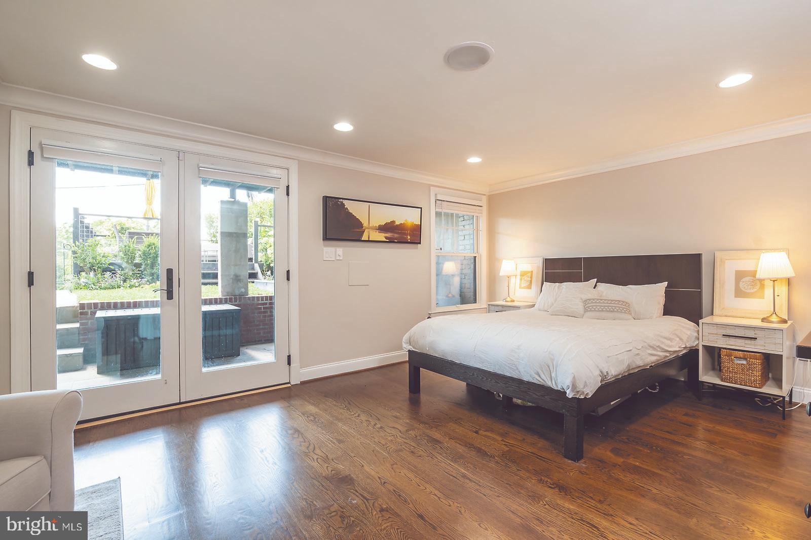 2026 North Capitol Street Northwest, Unit 1 Washington, DC 20002 - Photo 27 of 53 Master bedroom with doors to private patio