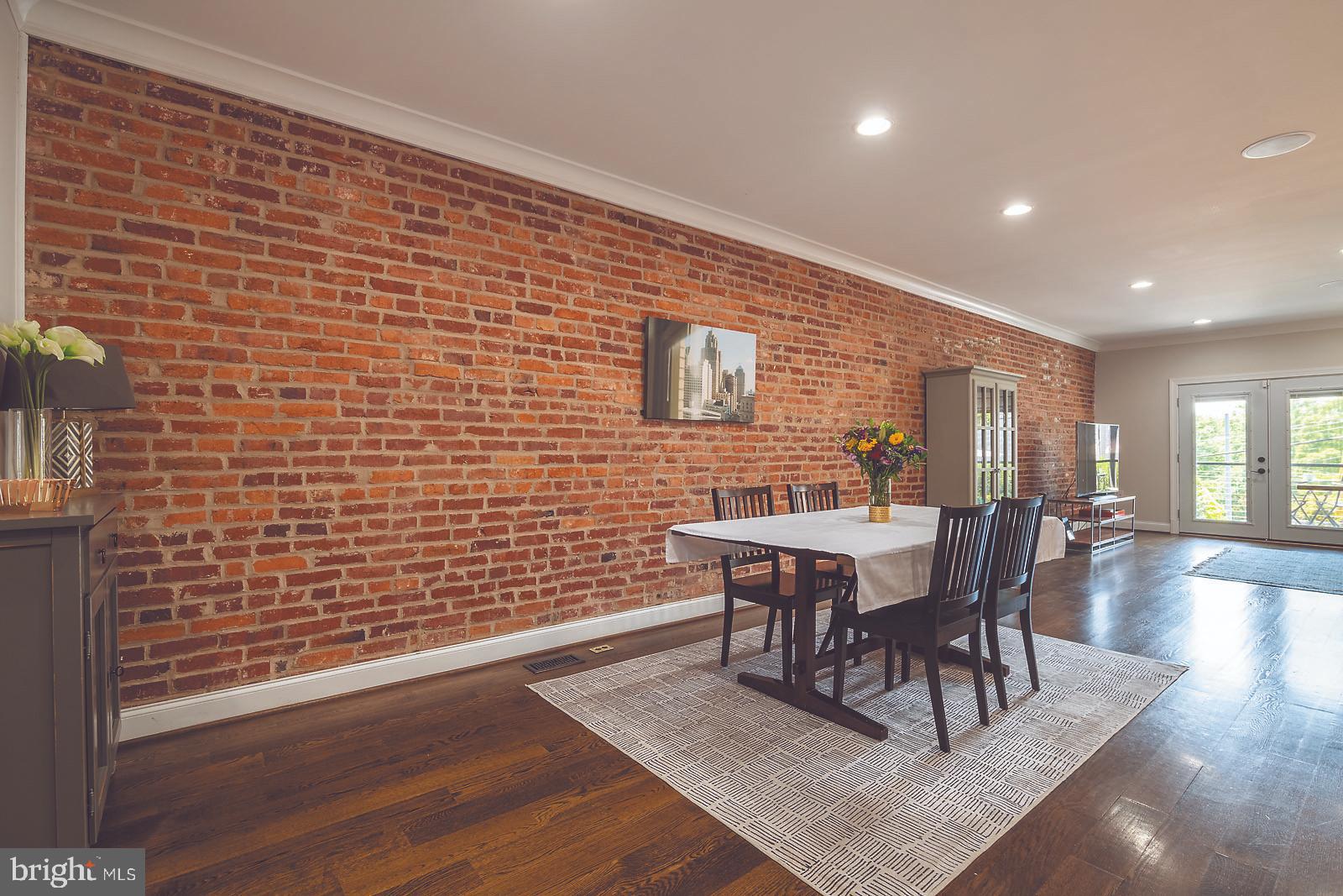 2026 North Capitol Street Northwest, Unit 1 Washington, DC 20002 - Photo 5 of 53 Dining area with exposed brick