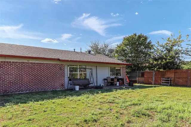 a view of a backyard with a garden and plants