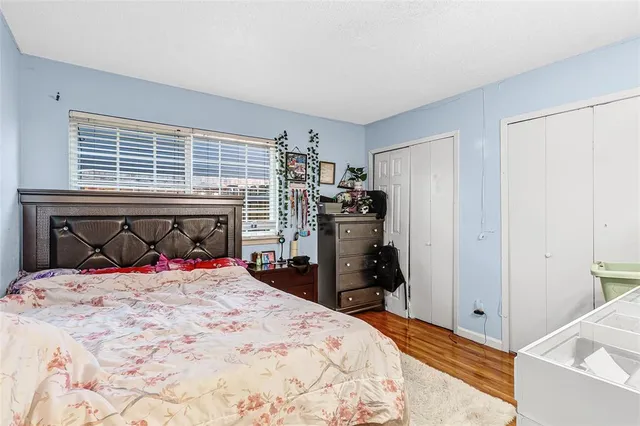 a bed room with a bed and a television