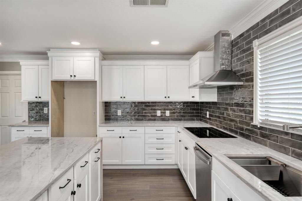 2801 Adelen Lane Round Rock, TX 78664 - Photo 12 of 29 a kitchen with granite countertop a sink stove and cabinets