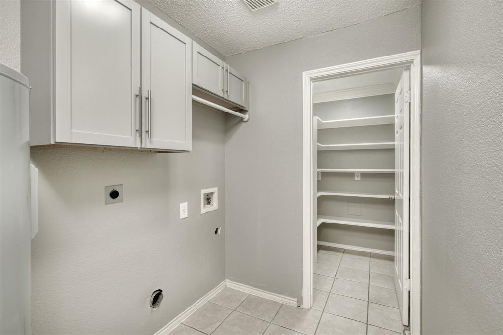 2801 Adelen Lane Round Rock, TX 78664 - Photo 14 of 29 a view of walk in closet with empty racks