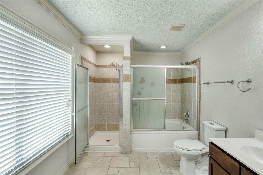 2801 Adelen Lane Round Rock, TX 78664 - Photo 25 of 29 a bathroom with a shower a toilet and a shower