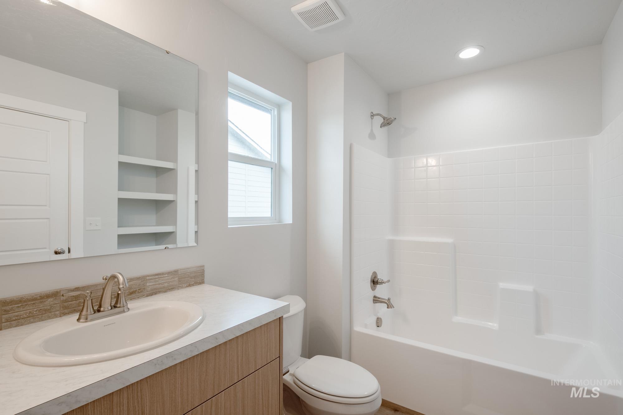 4155 North Delphi Avenue Meridian, ID 83646 - Photo 21 of 24 Bathroom featuring washtub / shower combination and vanity