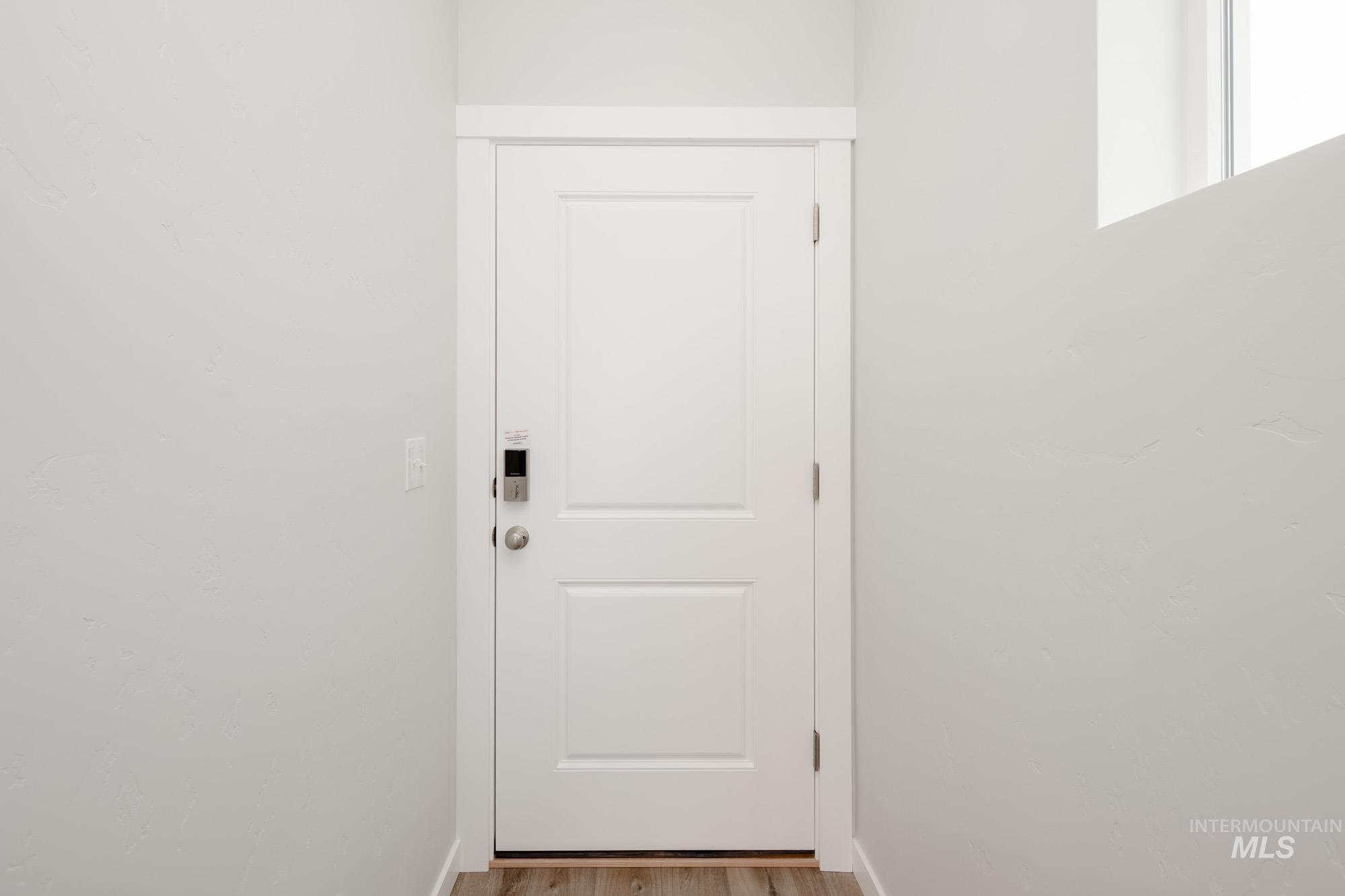 4155 North Delphi Avenue Meridian, ID 83646 - Photo 3 of 24 Entryway featuring wood finished floors and baseboards