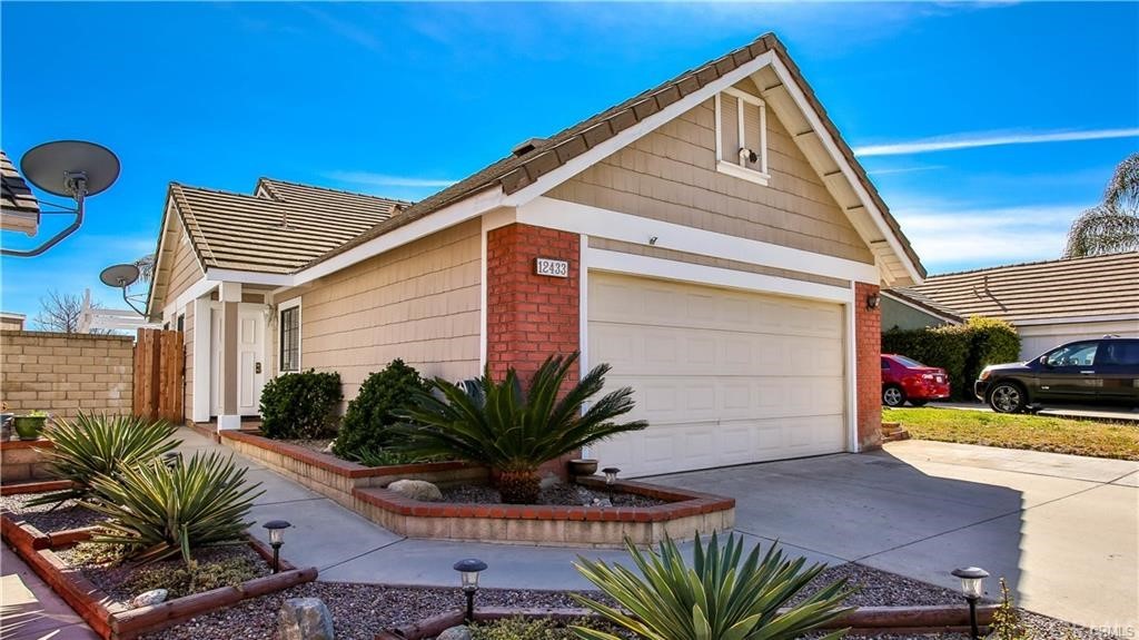 12433 Lily Court Rancho Cucamonga, CA 91739 - Photo 1 of 1 a front view of a house with garden
