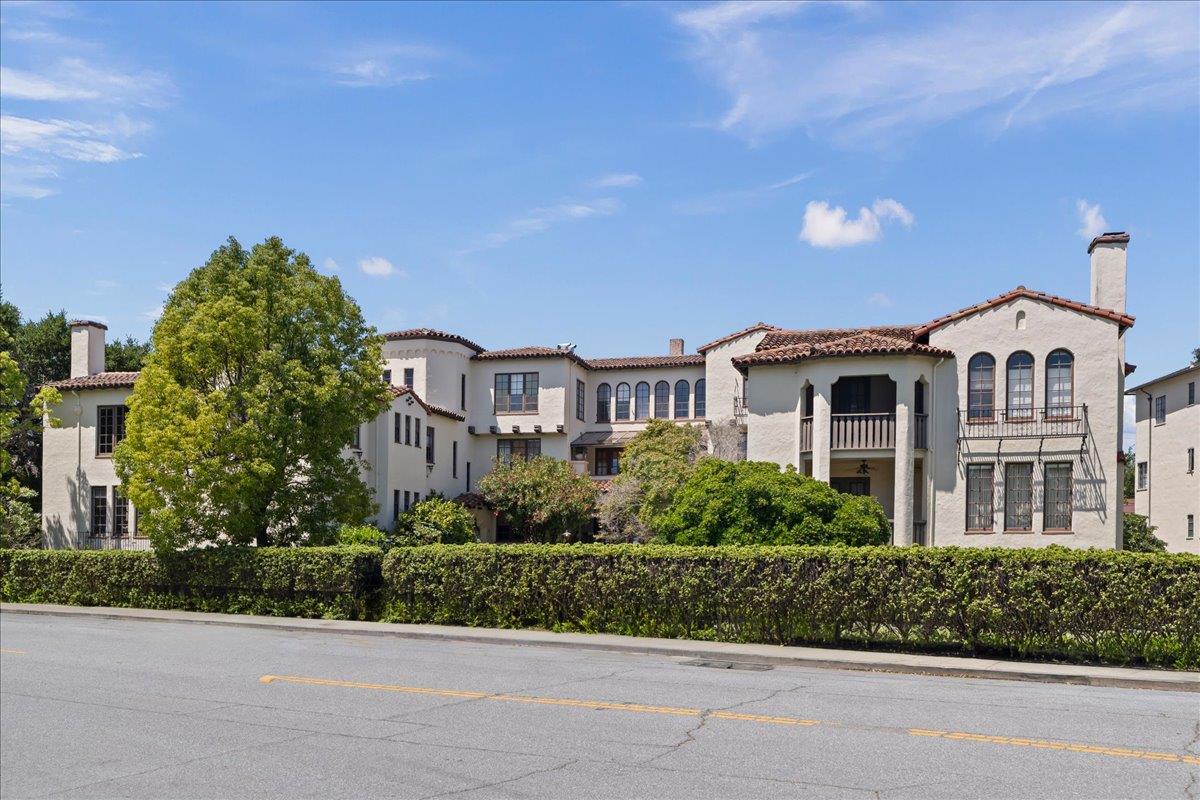 212 Eaton Road, Unit 22 San Mateo, CA 94402 - Photo 1 of 1 a front view of a residential apartment building with a yard