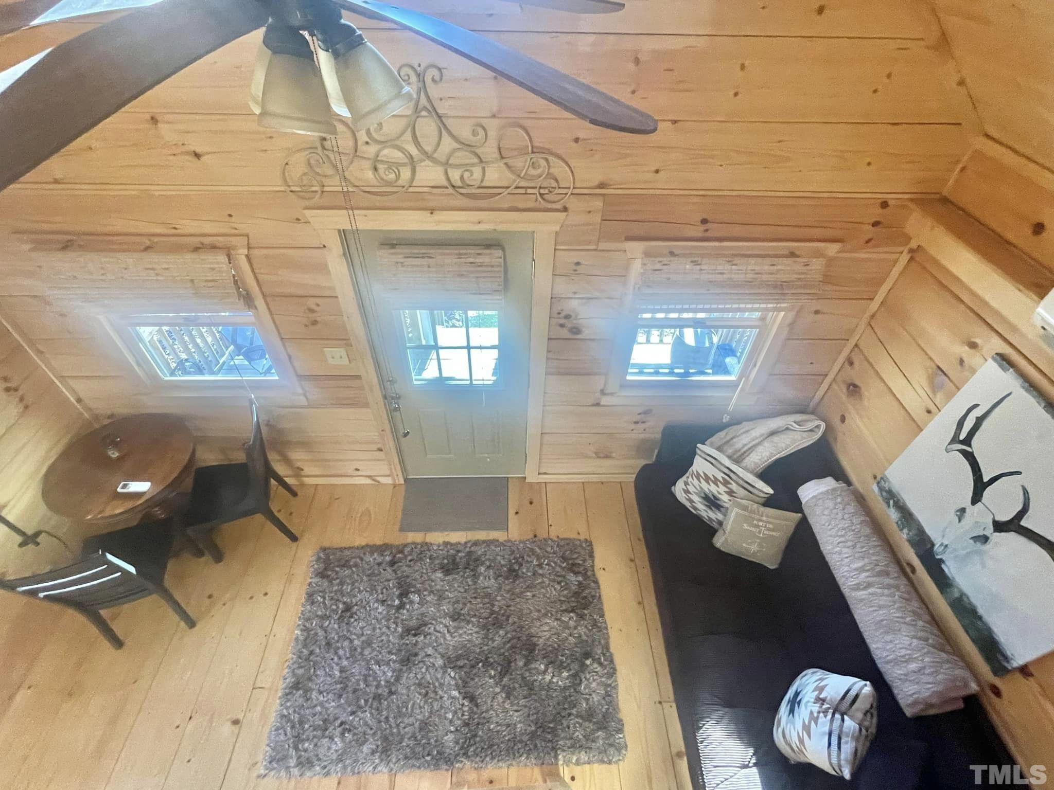 1183 John Allen Road Roxboro, NC 27574 - Photo 10 of 24 a living room with furniture and a floor to ceiling window