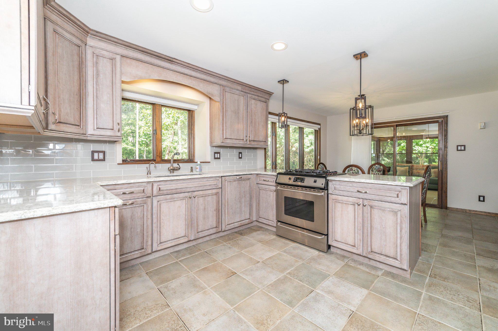 434 4th Street Atco, NJ 08004 - Photo 13 of 69 a kitchen with a stove a sink and a window