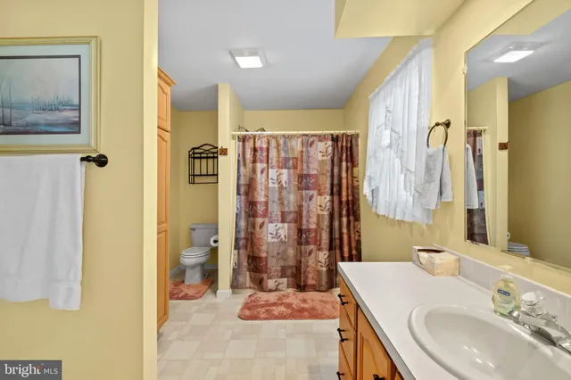 a bathroom with a shower and a sink