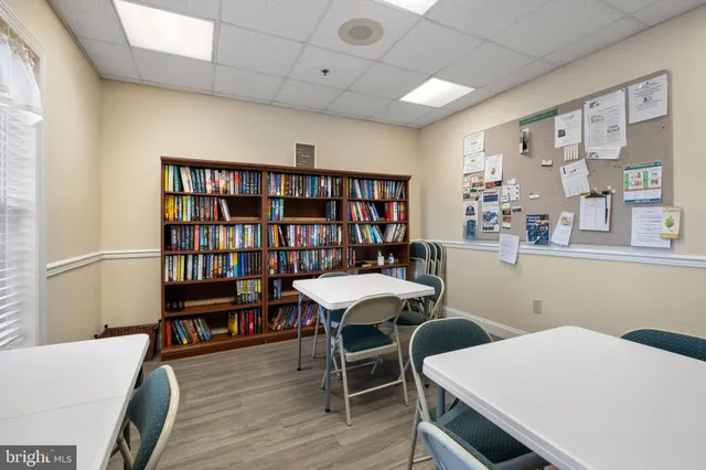 a dinning room with furniture and a flat screen tv