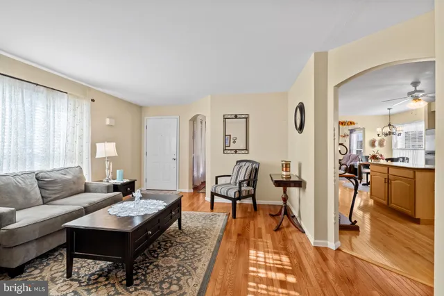 a room with furniture pool table and windows