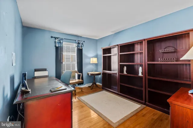 a kitchen with sink refrigerator and cabinets