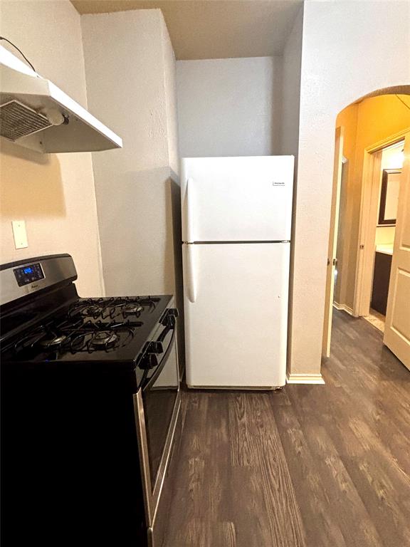 905 Isbell Road Fort Worth, TX 76114 - Photo 21 of 30 a kitchen with a refrigerator and a stove
