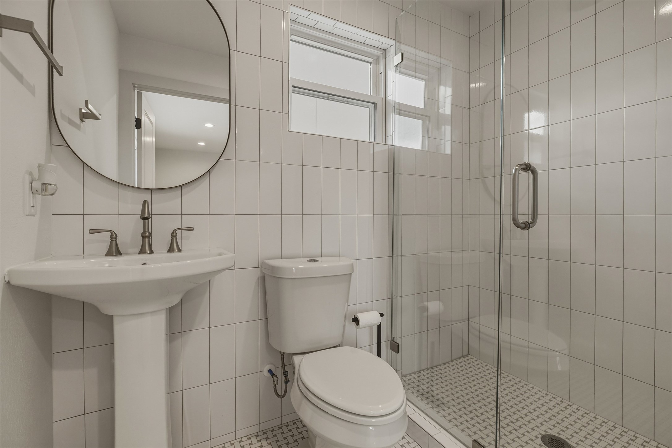1535 Rutland Street Houston, TX 77008 - Photo 47 of 50 a bathroom with a sink toilet a mirror and shower