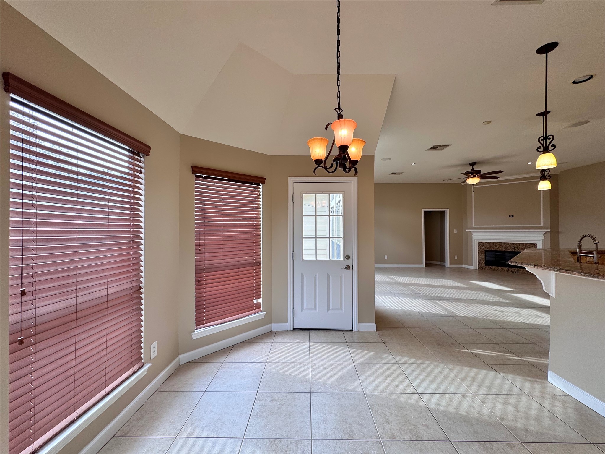 17243 Rush Trace Court Houston, TX 77095 - Photo 13 of 49 a view of a room with a flat screen tv and a ceiling fan
