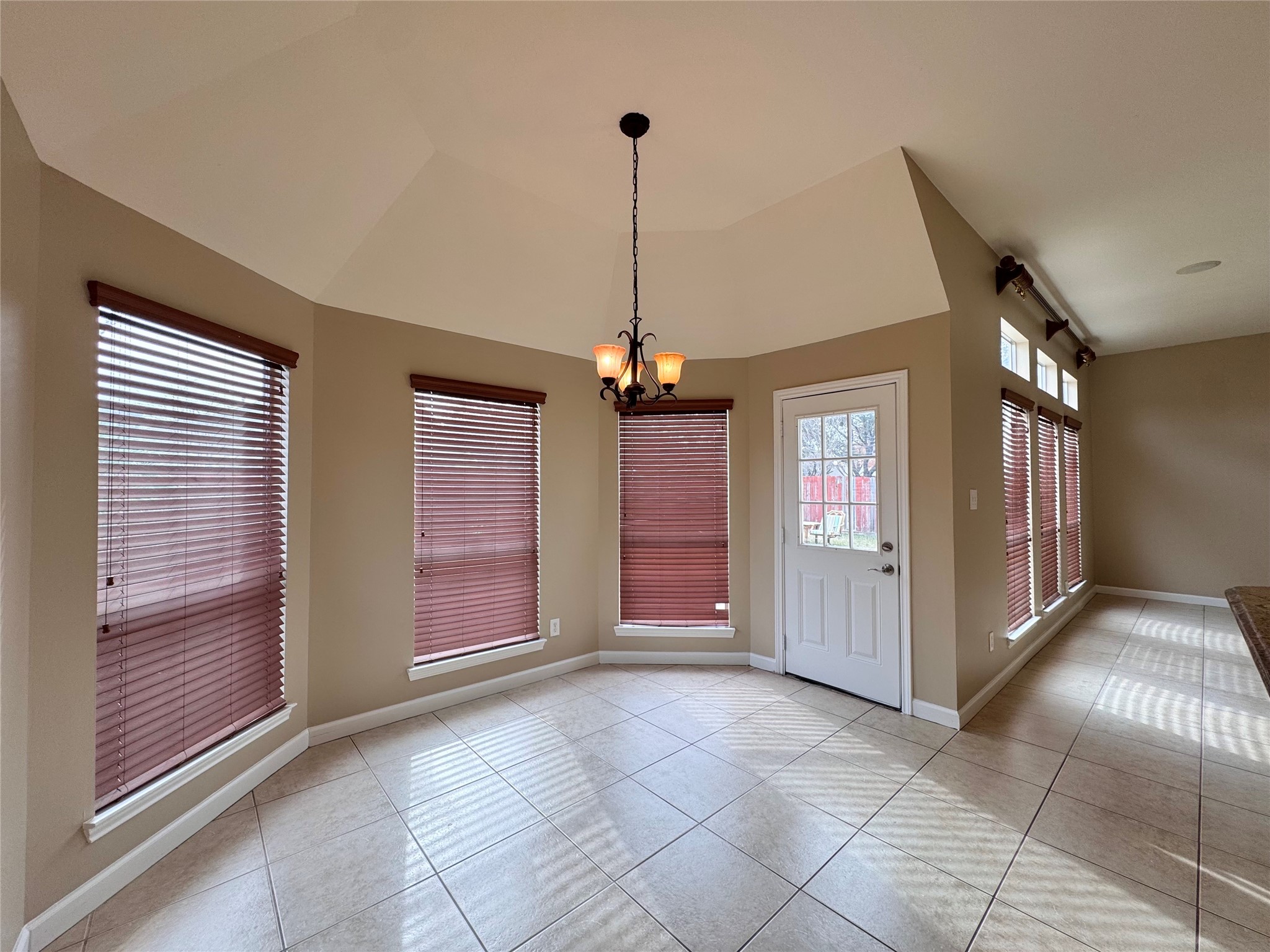 17243 Rush Trace Court Houston, TX 77095 - Photo 14 of 49 a view of a hallway with windows and chandelier
