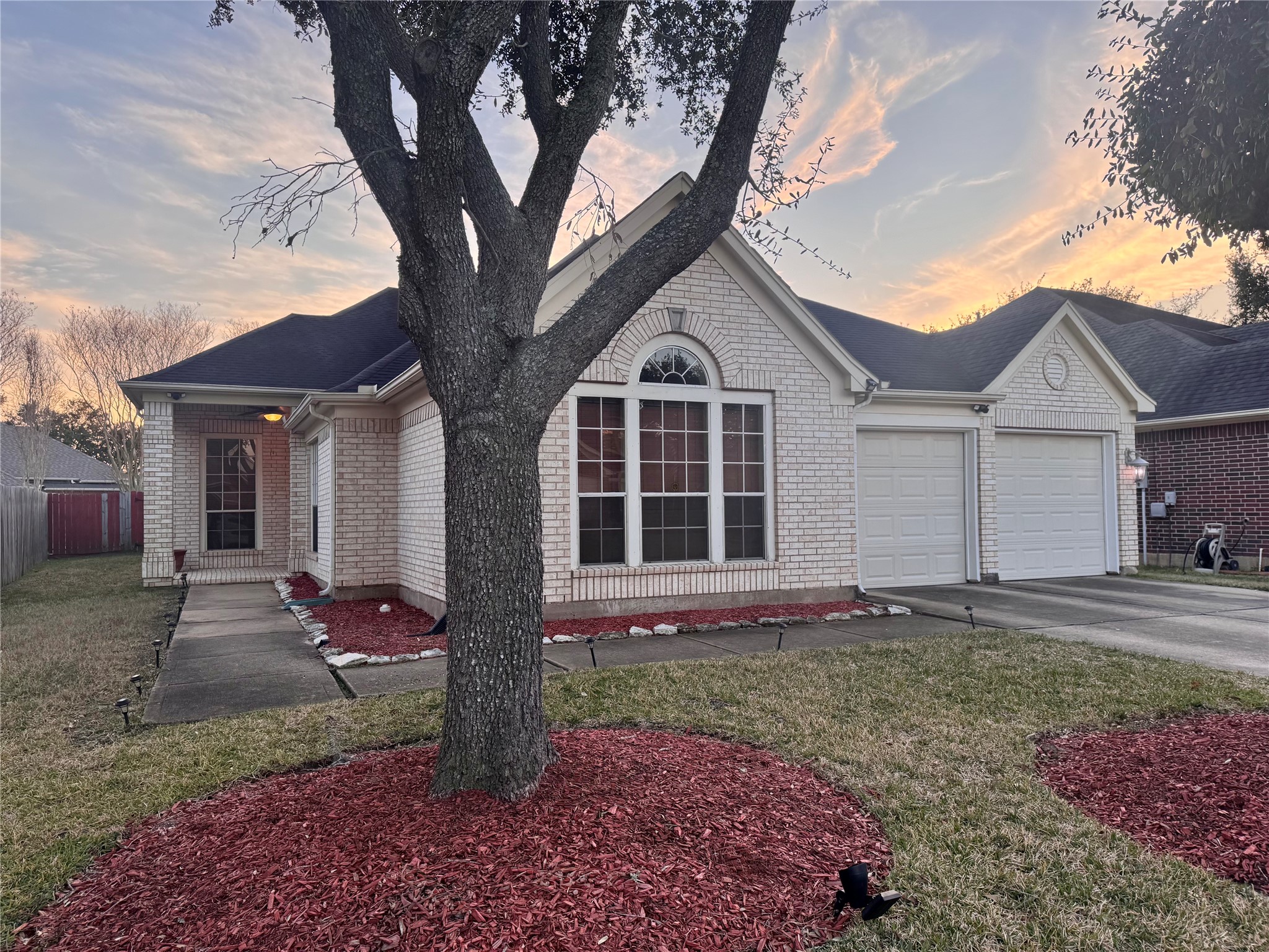 17243 Rush Trace Court Houston, TX 77095 - Photo 2 of 49 a front view of a house with a yard and garage