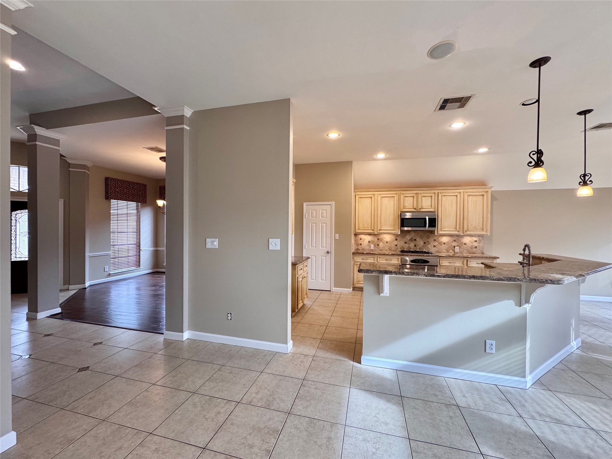 17243 Rush Trace Court Houston, TX 77095 - Photo 23 of 49 a kitchen with stainless steel appliances granite countertop a sink a stove and cabinets