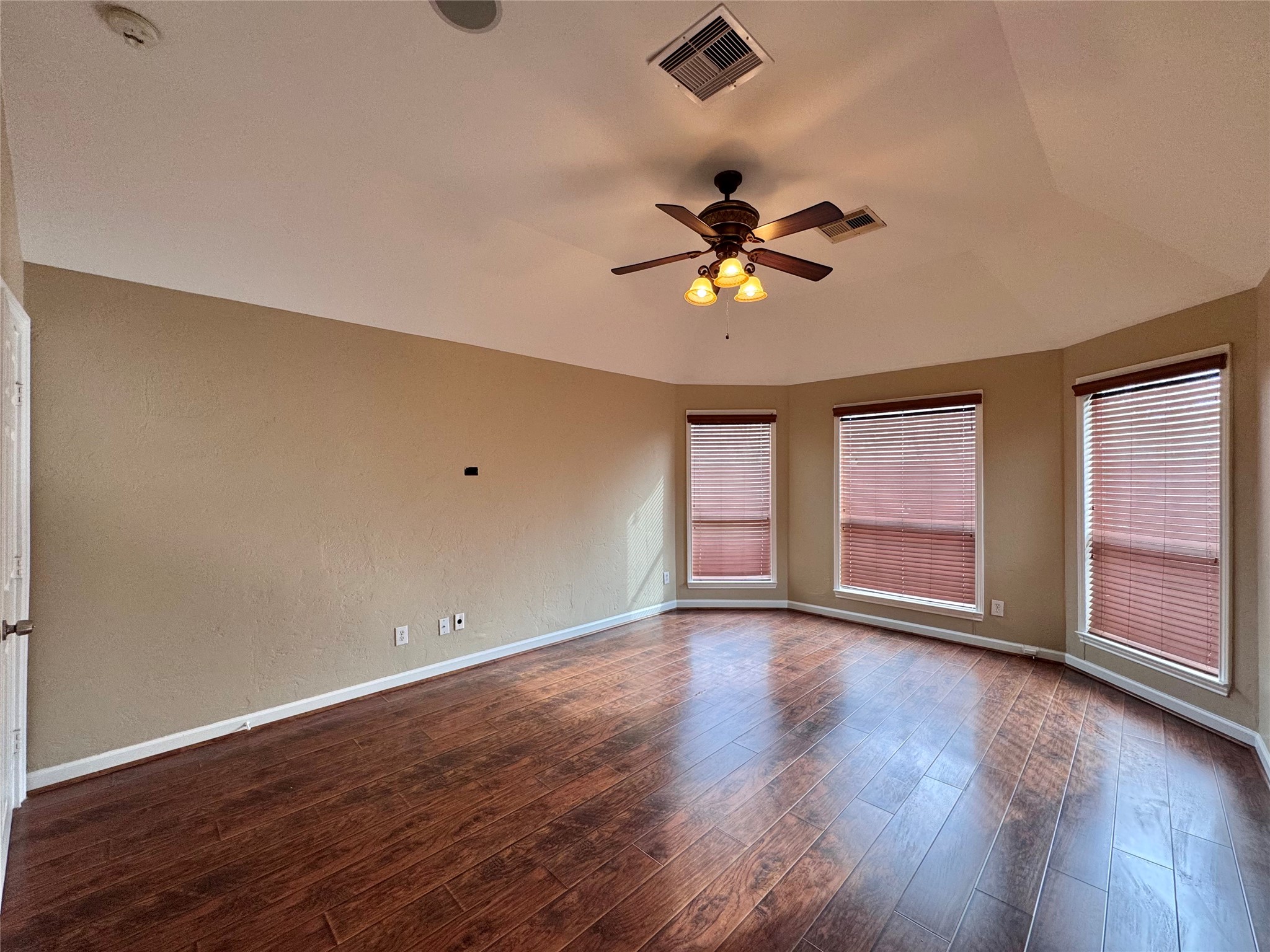 17243 Rush Trace Court Houston, TX 77095 - Photo 27 of 49 an empty room with wooden floor and windows